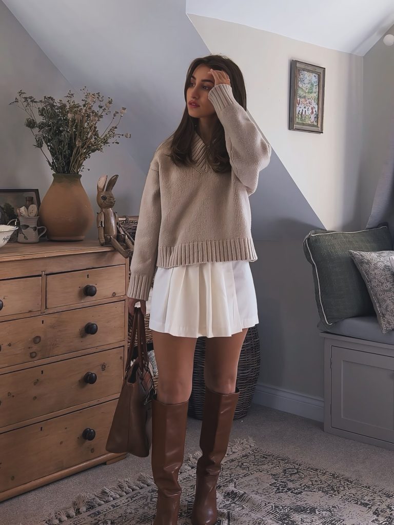  Beige V-Neck Sweater + White Pleated Mini Skirt + Brown Knee-High Boots