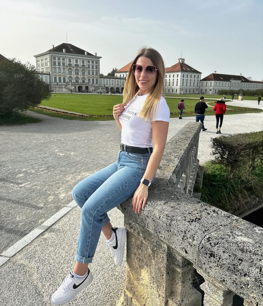 White Graphic T-Shirt + Light Wash Jeans + White Sneakers
