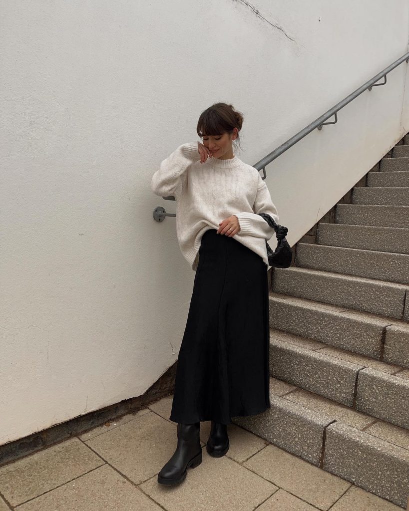 Cream Oversized Sweater + Black Satin Midi Skirt + Leather Boots