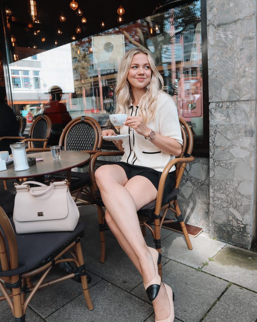 Cream Cardigan + Black Mini Skirt + Two-Tone Flats