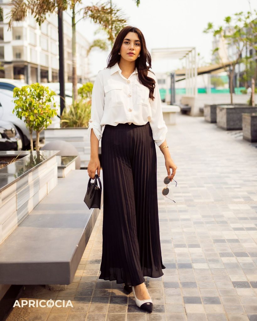 Black Pleated Maxi Skirt + White Button-Down Shirt + Two-Tone Pumps