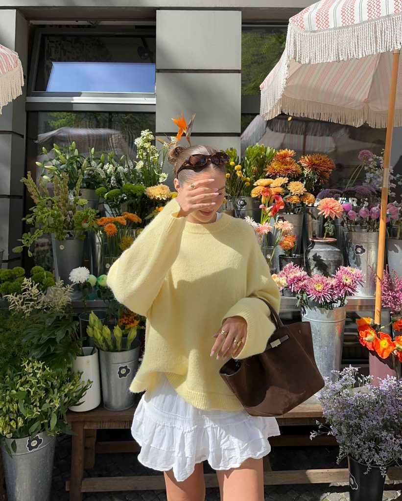 Yellow Oversized Sweater + White Ruffled Skirt + Brown Suede Bag