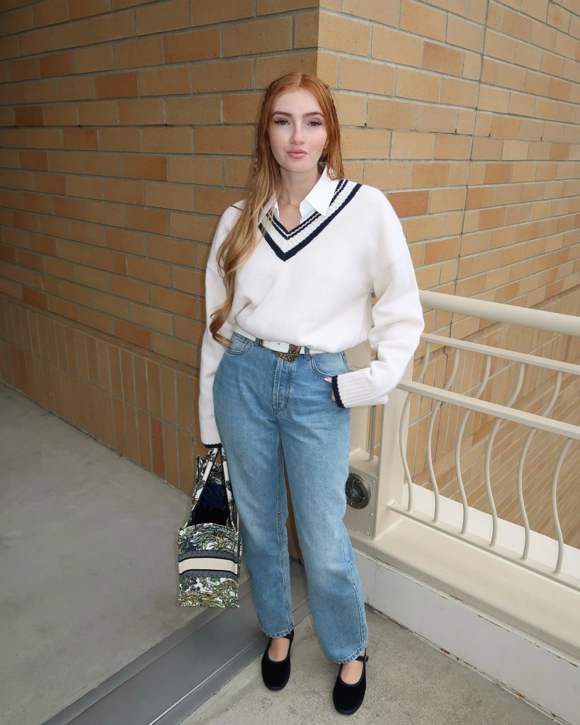 White V-Neck Varsity Sweater + Light Wash Jeans + Black Mary Jane Flats