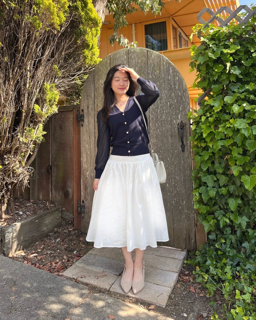 White A-Line Skirt + Navy Cardigan + Nude Slingbacks