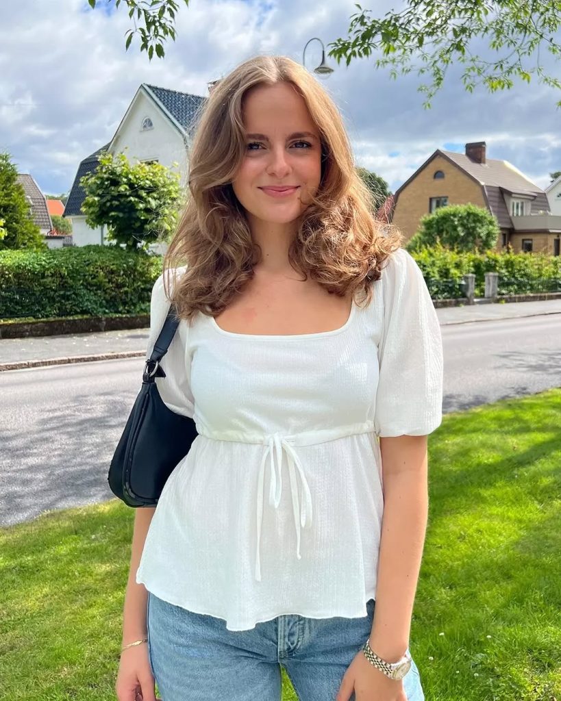 White Peplum Blouse + Light Wash Jeans + Black Shoulder Bag