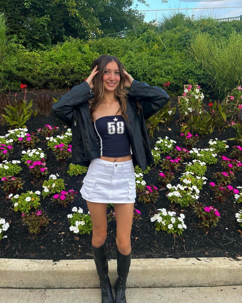 Black Moto Jacket + Graphic Tube Top + White Cargo Mini Skirt