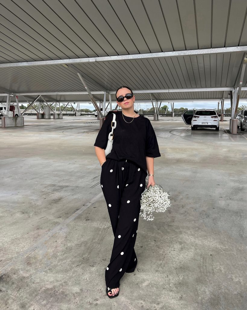 Black Oversized T-Shirt + Polka Dot Trousers + White Chain Bag