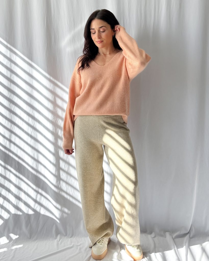 Peach V-Neck Sweater + Beige Wide-Leg Trousers