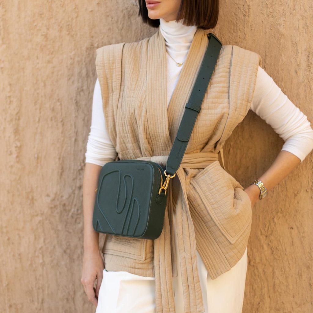 Tan Quilted Vest + White Turtleneck + White Trousers