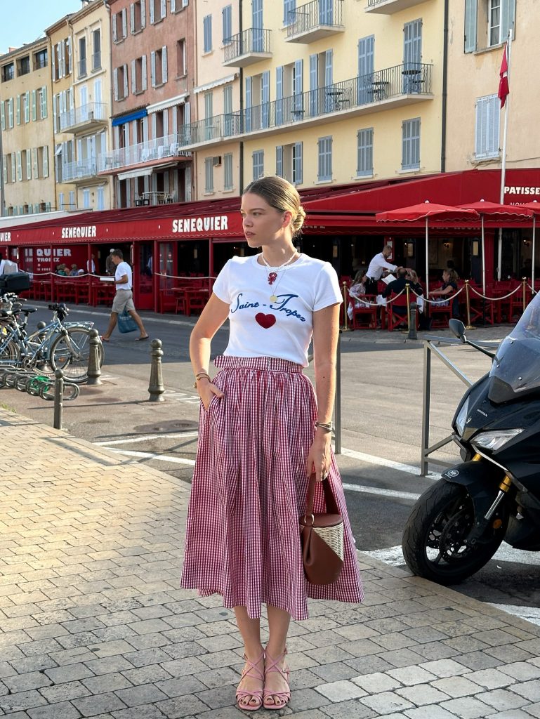 White Graphic T-shirt + Red Gingham Midi Skirt + Pink Strappy Sandals