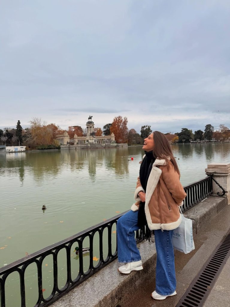Tan Shearling Jacket + Black Turtleneck + Wide-Leg Jeans