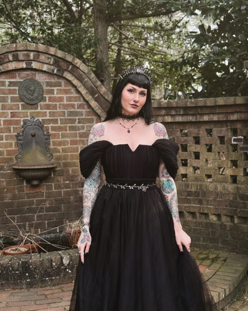 Black Off-the-Shoulder Gown + Ornate Belt + Spike Crown