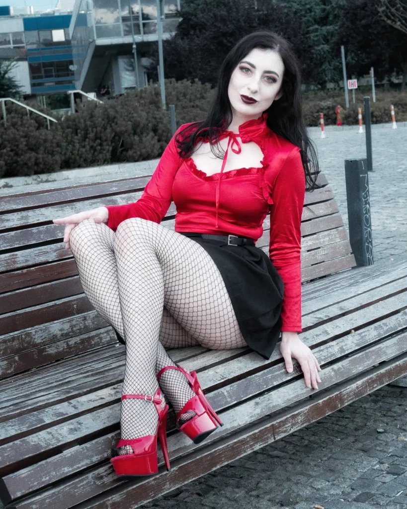 Red Ruffled Blouse + Black Mini Skirt + Fishnet Tights