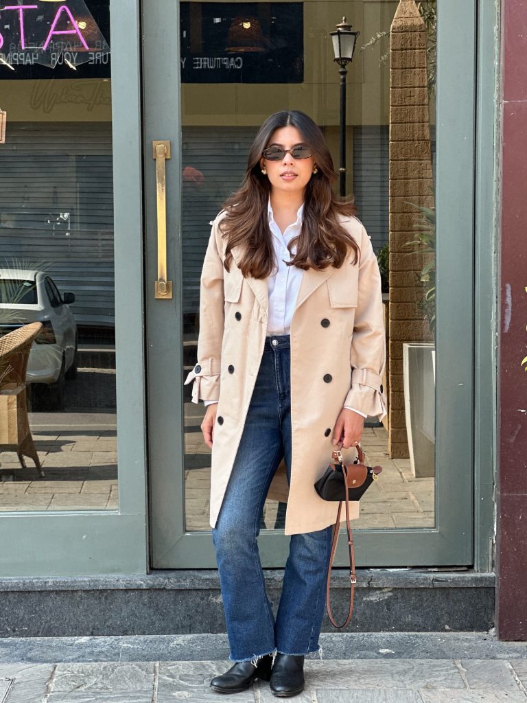 Tan Trench Coat + White Button-Down + Flare Jeans