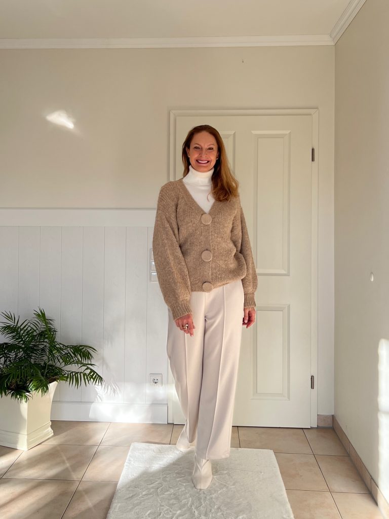 Beige Cardigan + White Turtleneck + Off-White Trousers