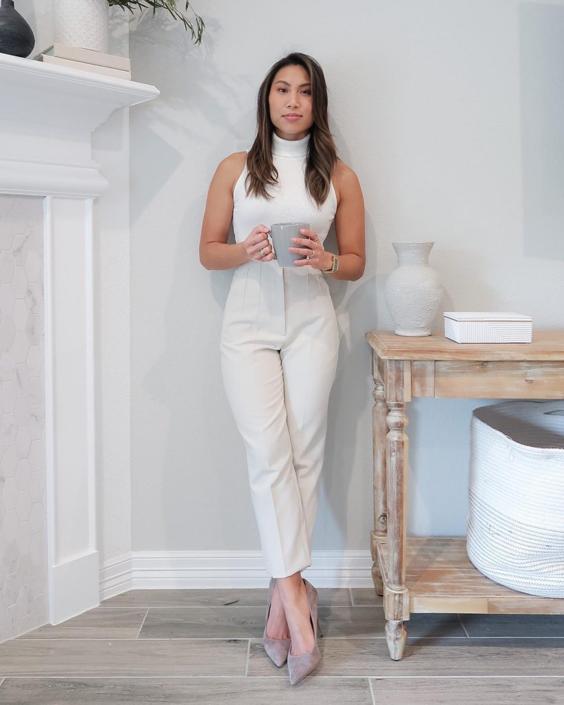 White Turtleneck + Sleeveless Top + Cream Tapered Pants