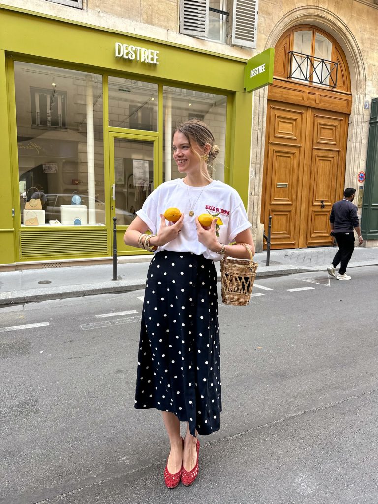 White Graphic T-Shirt + Black Polka-Dot Midi Skirt + Red Woven Flats