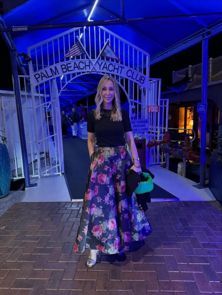 Black Short-Sleeve Top + Floral Ball Skirt + Green Quilted Clutch