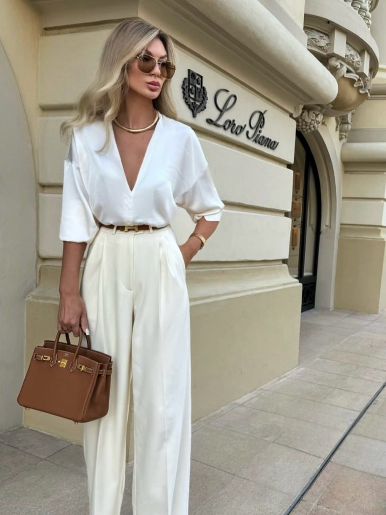 White V-Neck Silk Blouse + Ivory Wide-Leg Trousers + Tan Leather Handbag