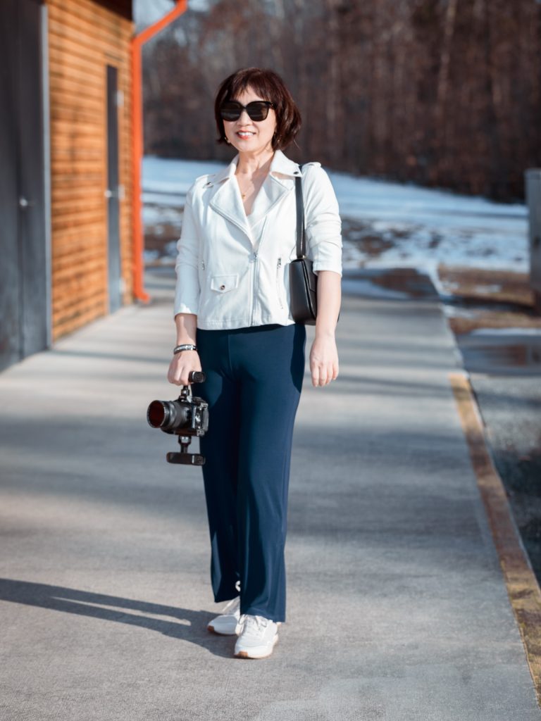 White Biker Jacket + Navy Wide-Leg Pants + White Sneakers