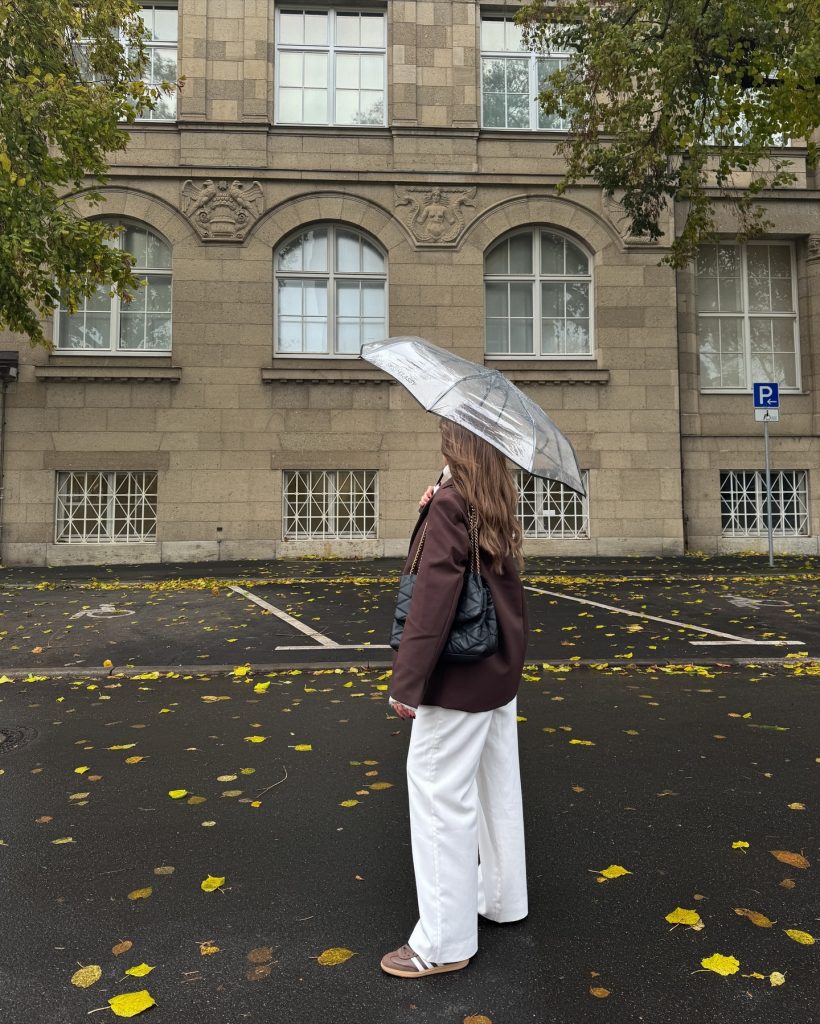 Brown Blazer + White Trousers + Clear Umbrella