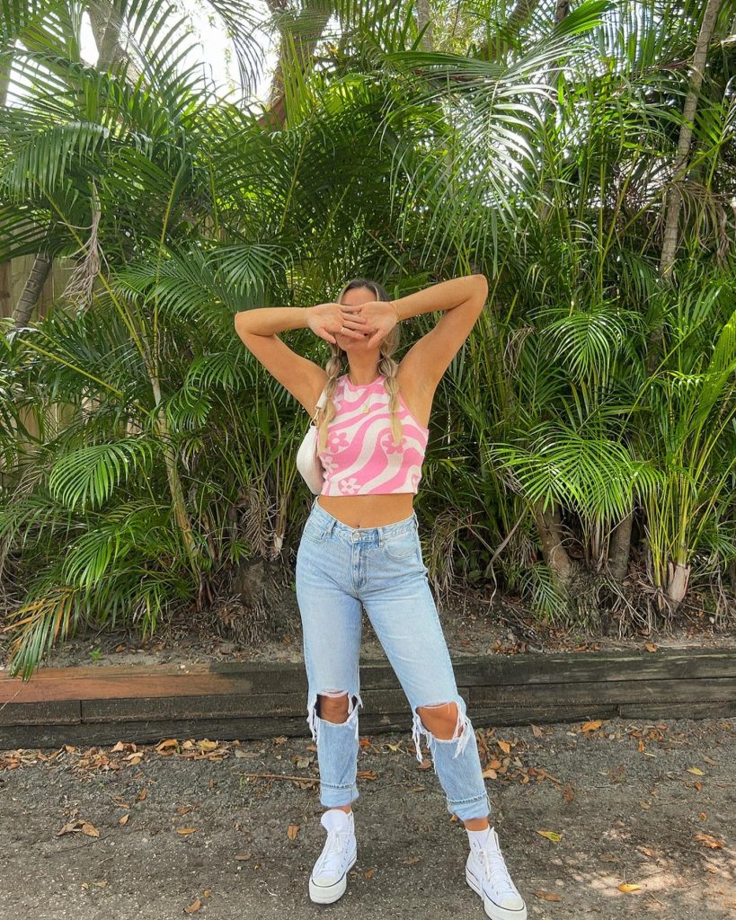 Pink Swirl Crop Top + Ripped Light-Wash Jeans + High-Top Sneakers