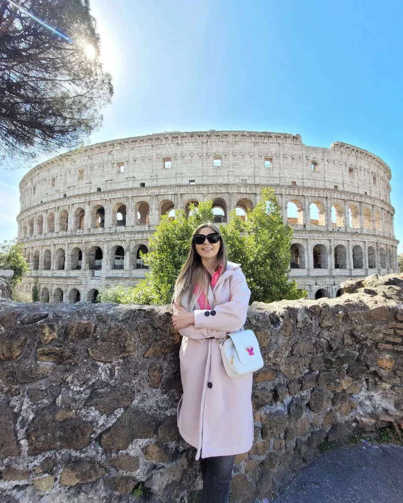 Pale Pink Overcoat + Fuchsia Top + Black Skinny Jeans
