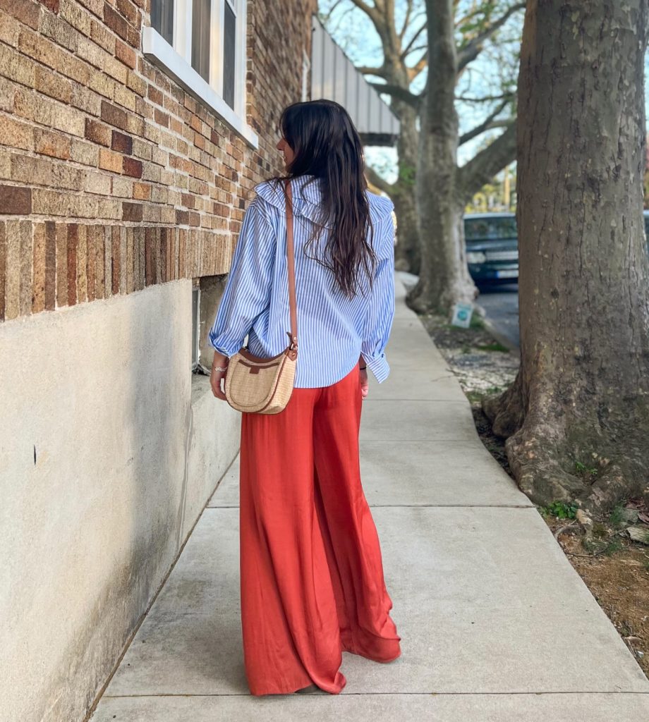 Blue Striped Ruffle Shirt + Rust Wide-Leg Pants + Straw Crossbody Bag