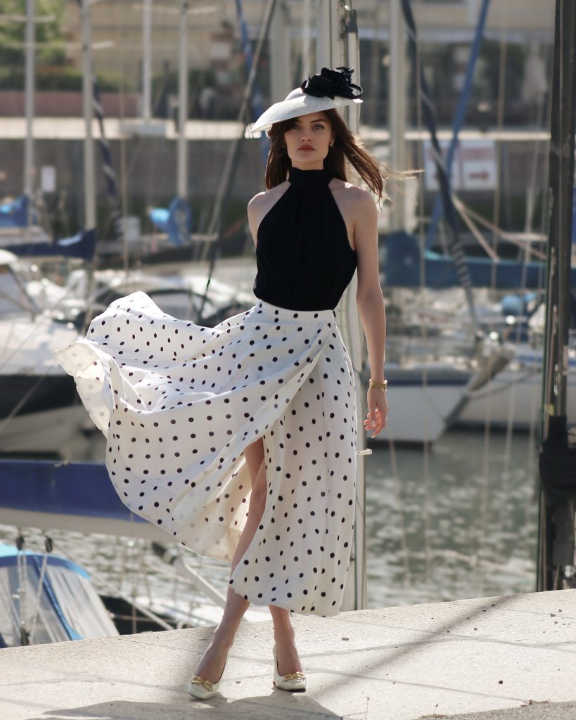 White Polka Dot Maxi Skirt + Black Halter Neck Top + Wide Brim Fascinator