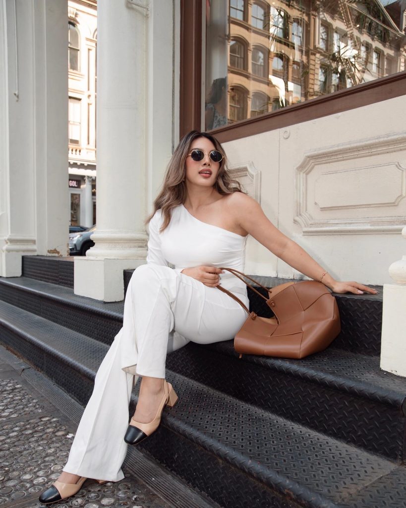 White One-Shoulder Jumpsuit + Tan Oversized Tote + Two-Tone Pumps