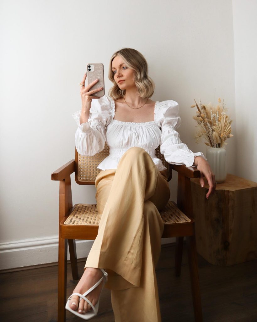 White Puff-Sleeve Blouse + Tan Wide-Leg Trousers