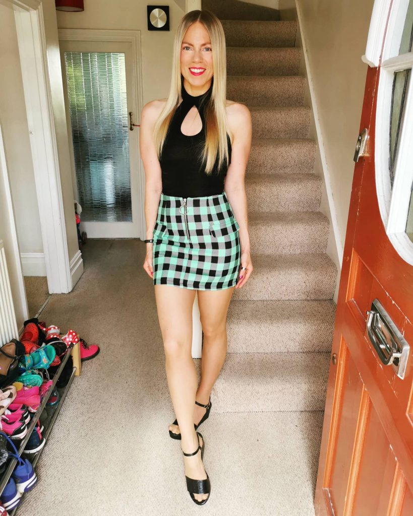 Black Cut-Out Halter Bodysuit + Green Checkered Mini Skirt + Strappy Sandals