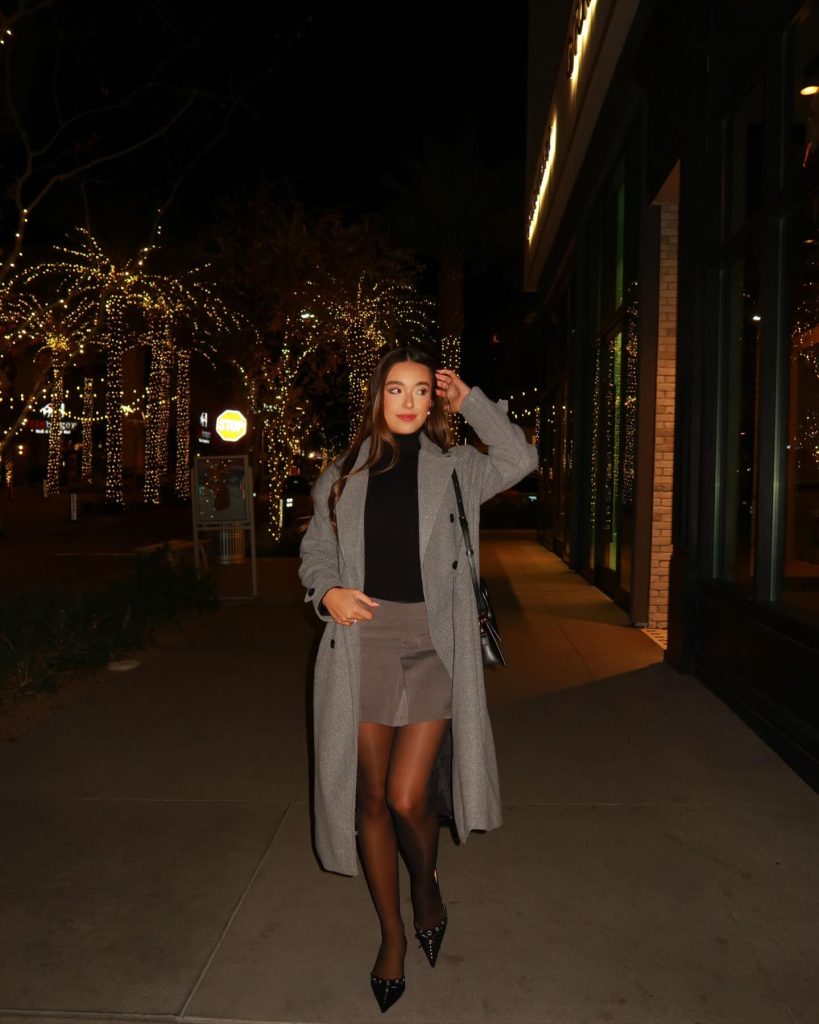 Grey Overcoat + Black Turtleneck + Taupe Mini Skirt