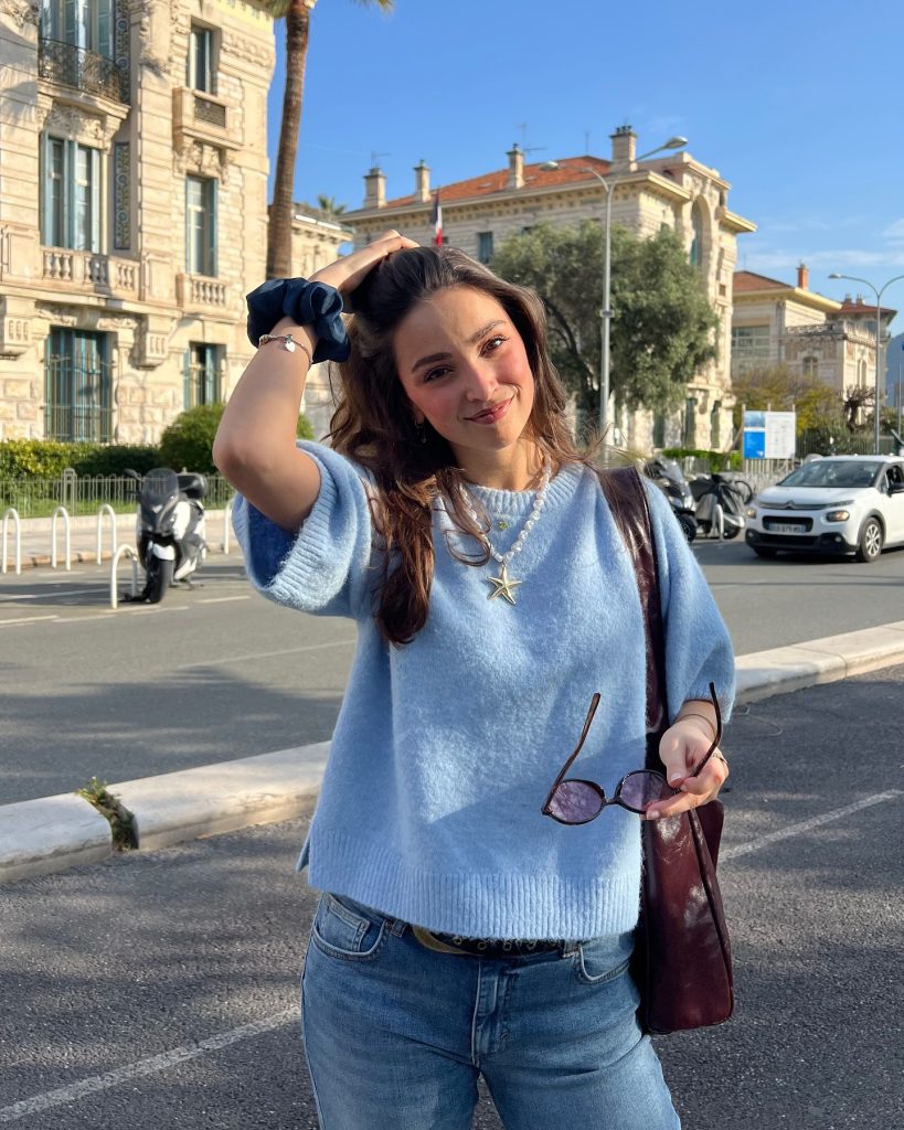 Light Blue Short-Sleeve Knit + Starfish Pendant Necklace + Medium Wash Denim