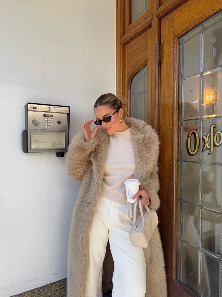 Beige Faux Fur Coat + Cream Mock-Neck Sweater + White Wide-Leg Trousers