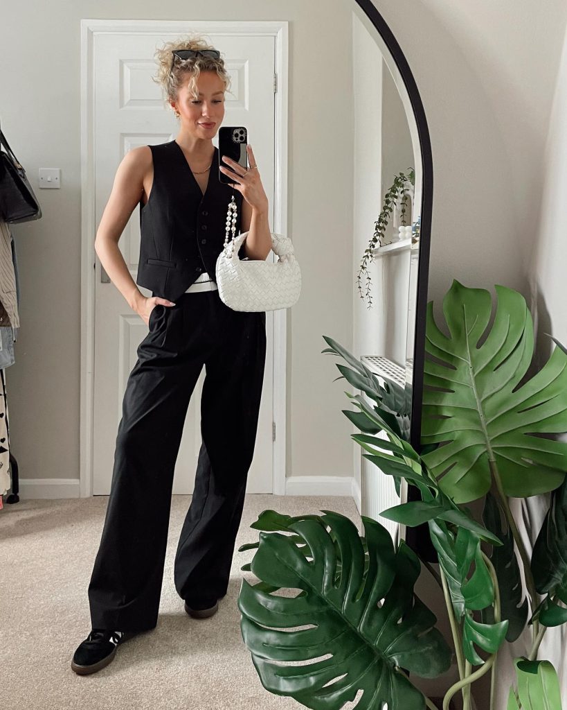 Black Waistcoat + Black Wide-Leg Trousers + White Braided Bag