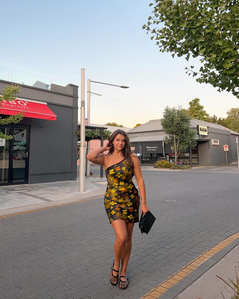 Dark Floral One-Shoulder Dress + Mesh Ballet Flats + Black Mini Bag
