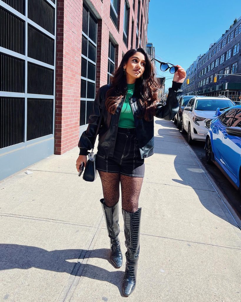 Black Leather Jacket + Green Mock-Neck Top + Black Denim Shorts