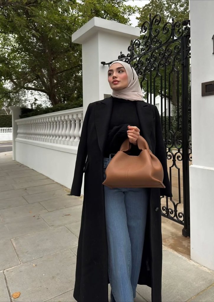 Black Long Coat + Light Wash Jeans + Camel Handbag