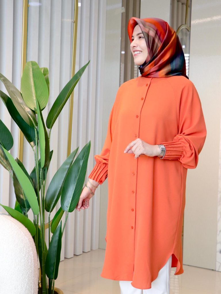 Vibrant Orange Tunic + Multicolored Satin Hijab + White Slim-Fit Pants