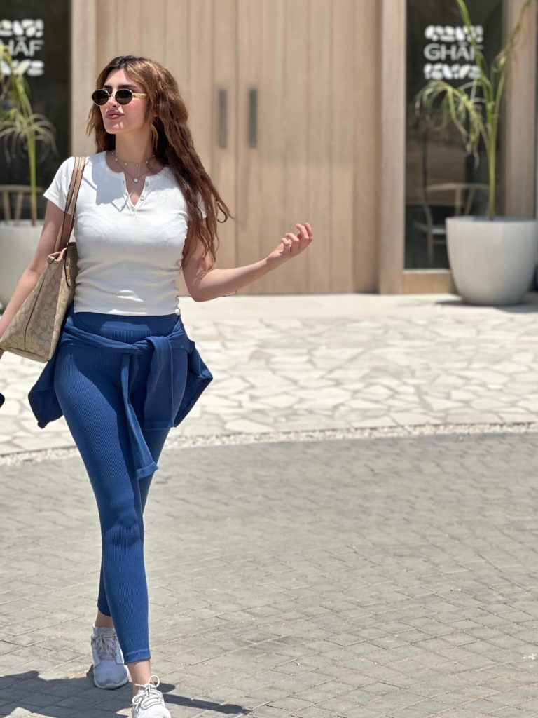  White Henley Tee + Ribbed Blue Leggings + Coach Tote Bag