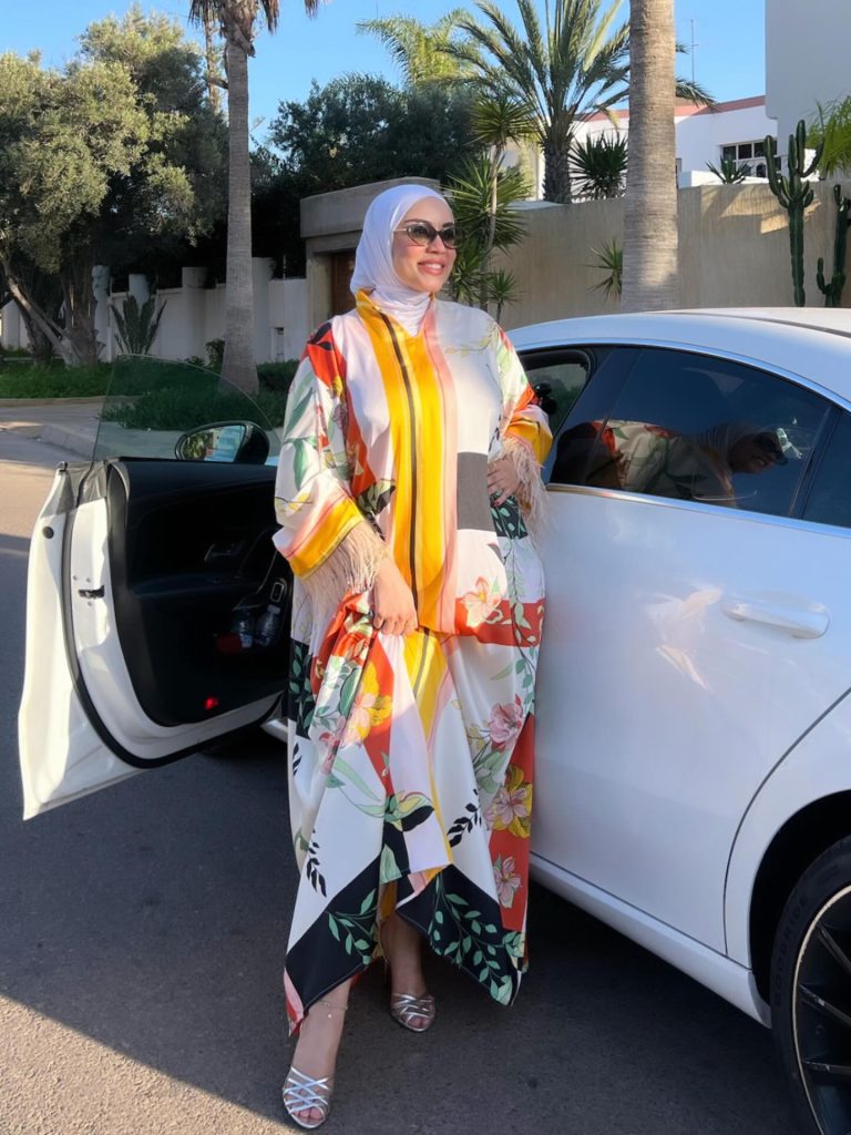 Multi-Color Patterned Kaftan + White Hijab + Silver Strappy Sandals