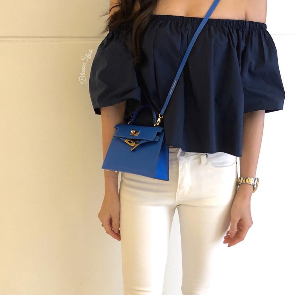 Navy Off-Shoulder Blouse + White Skinny Jeans + Royal Blue Mini Bag