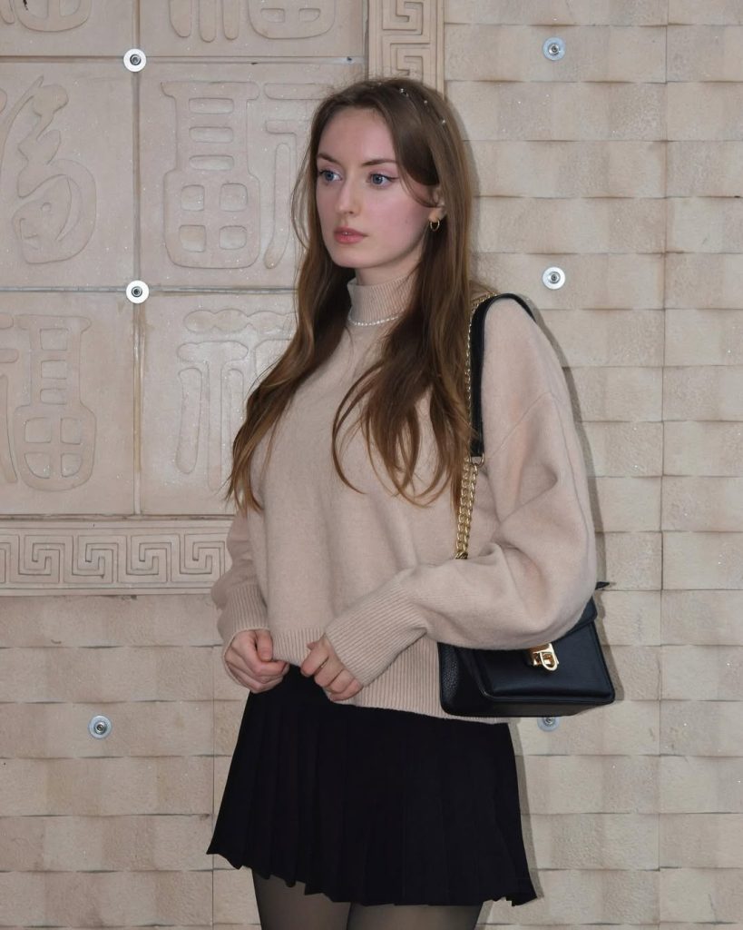 Beige Turtleneck + Black Pleated Skirt + Chain Bag