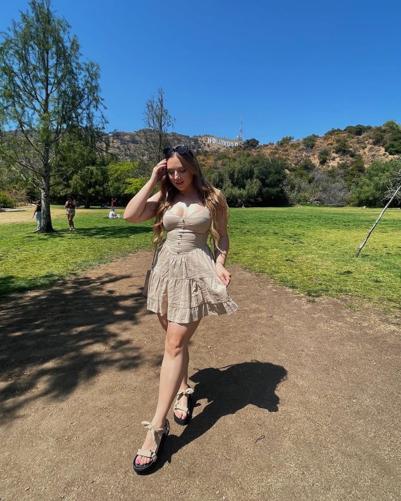 Beige Tiered Mini Dress + Black Sunglasses + Sporty Sandals