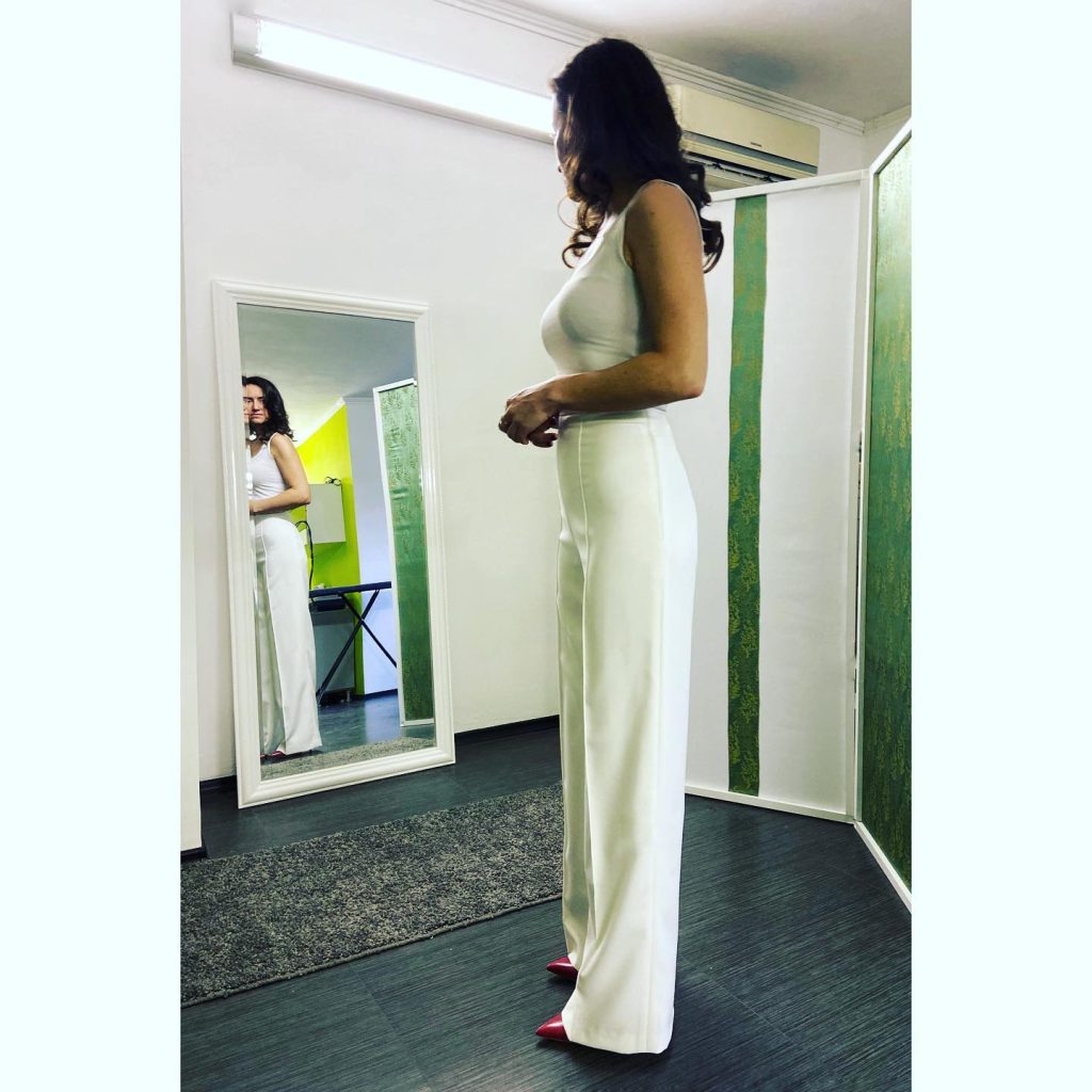 White Fitted Tank Top + High-Waisted White Trousers + Red Pointed Heels