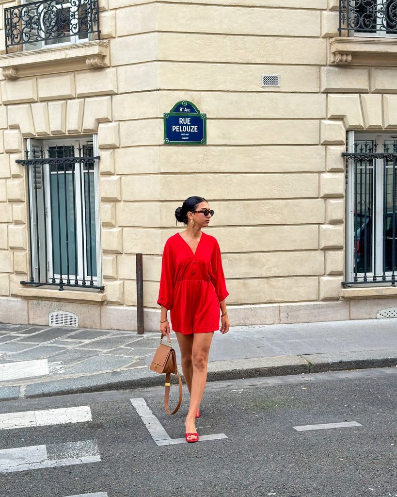 Red Long-Sleeved Romper + Brown Leather Handbag