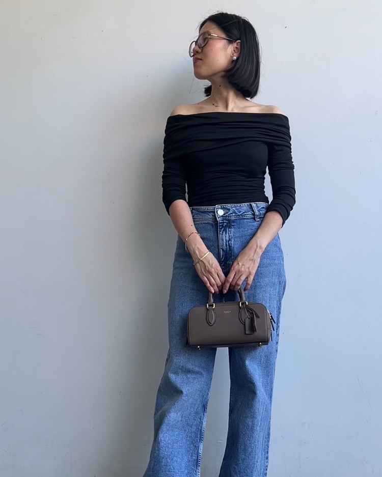Black Ruched Long-Sleeve Top + Blue Straight-Leg Jeans + Mini Satchel