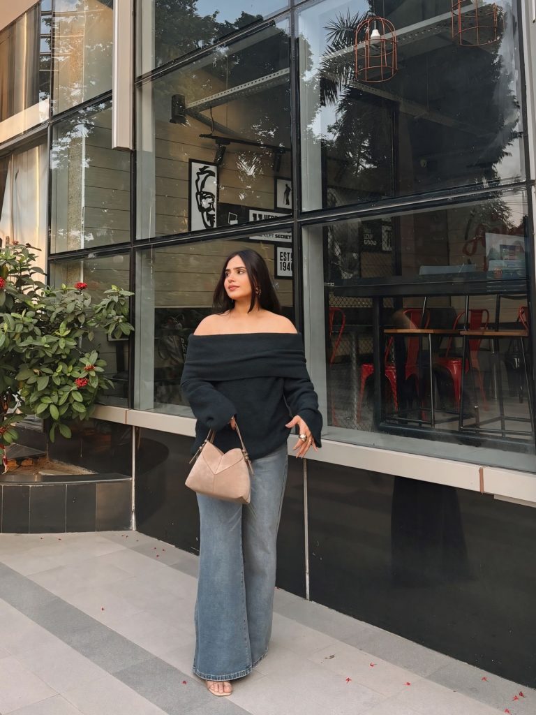 Charcoal Off-Shoulder Sweater + Wide-Leg Jeans + Beige Handbag