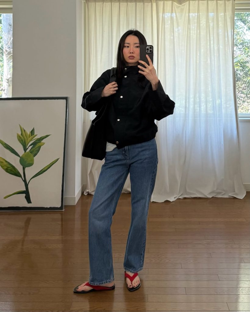 Black Snap-Front Jacket + Blue Relaxed Jeans + Red Thong Sandals